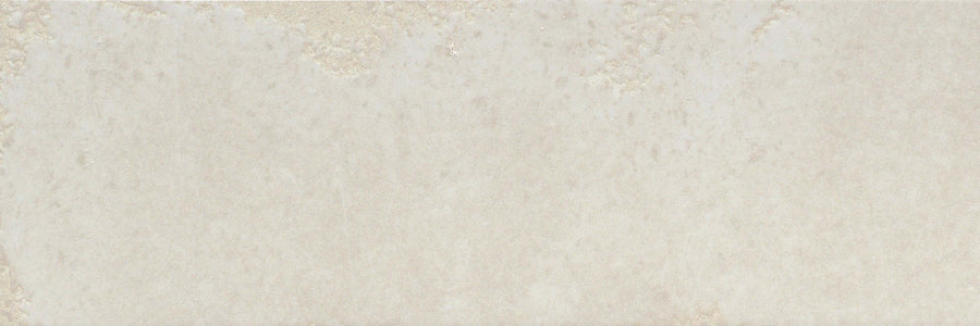Catalyst 4x12 Porcelain Tile in Ion White features a light beige textured surface with subtle color variations, a slightly mottled, cloudy look, and a hint of multi-finish glaze.