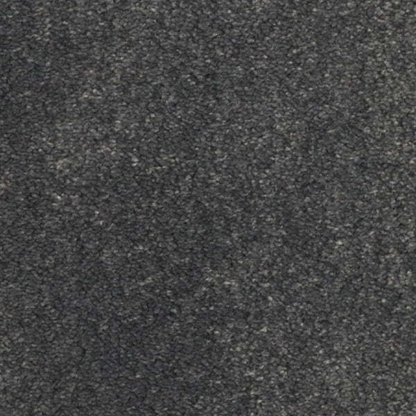 Close-up of Seduction On Trend Carpet in Iron Gate, showcasing a soft, subtly shaded dark gray surface with slight texture variations for an inviting and durable flooring choice.