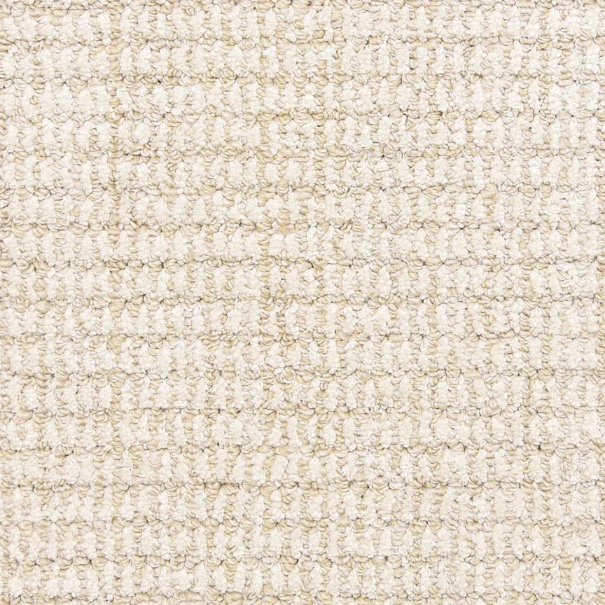 Close-up of the Aspen Berber Carpet in Ivory shows its tight, looped weave pattern for a grid-like look. The material appears soft, uniform, and highly durable.