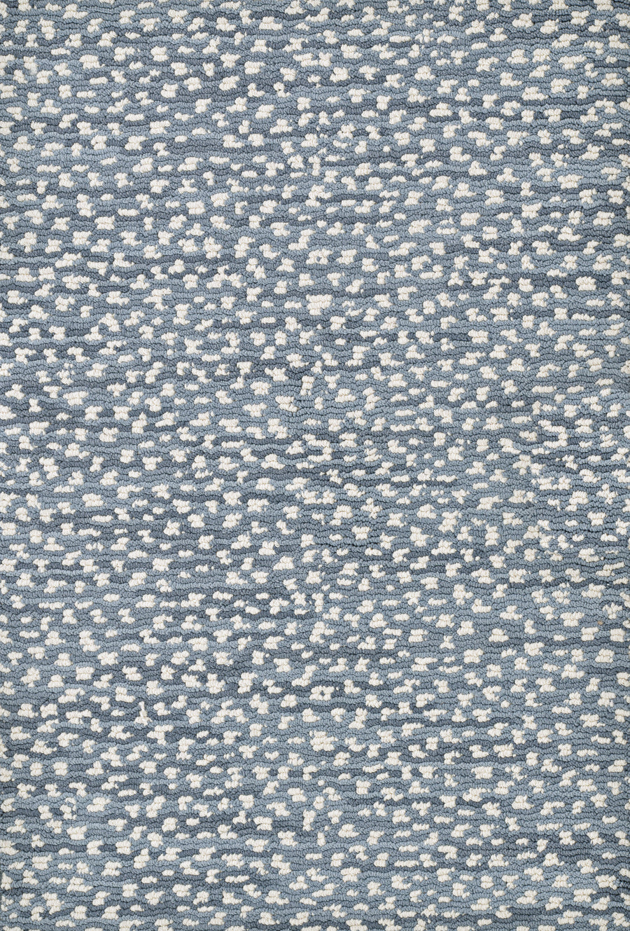 Close-up of Jag On Trend Carpet, featuring a blue and white speckled pattern that resembles scattered dots or clouds—a luxurious, stylish choice for contemporary interiors.