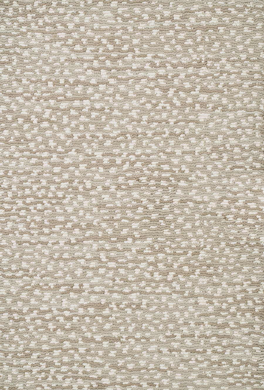 A close-up of Jag On Trend Carpet shows beige fabric with a textured pattern of small, irregular white and tan dots, giving it a subtle, abstract pebble-like look—ideal for bringing luxurious elegance to any stylish space.