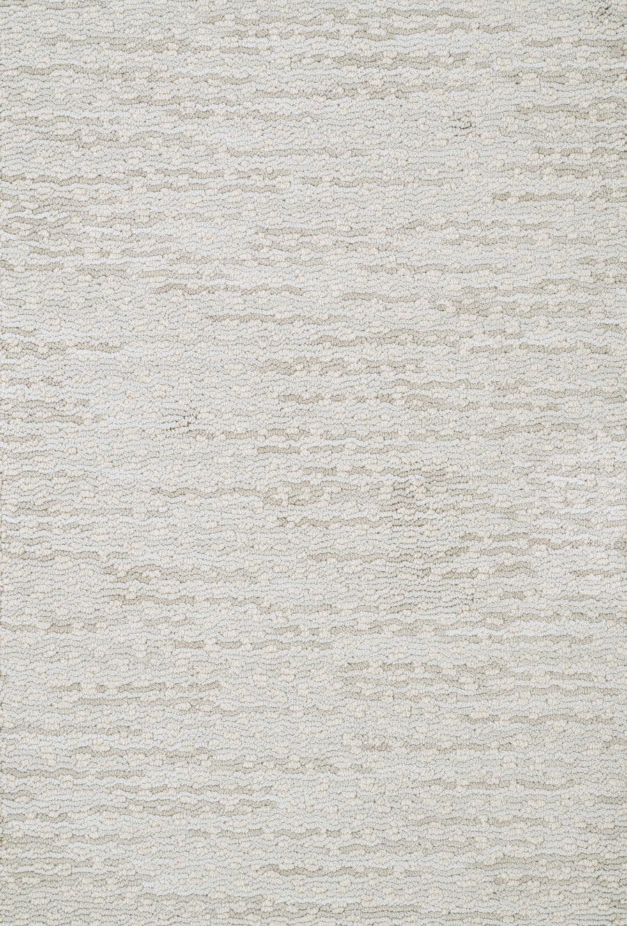 A close-up of Jag On Trend Carpet shows its textured light beige surface with subtle wavy patterns. This soft, neutral, and elegant design makes it a luxurious and stylish carpet choice for any space.