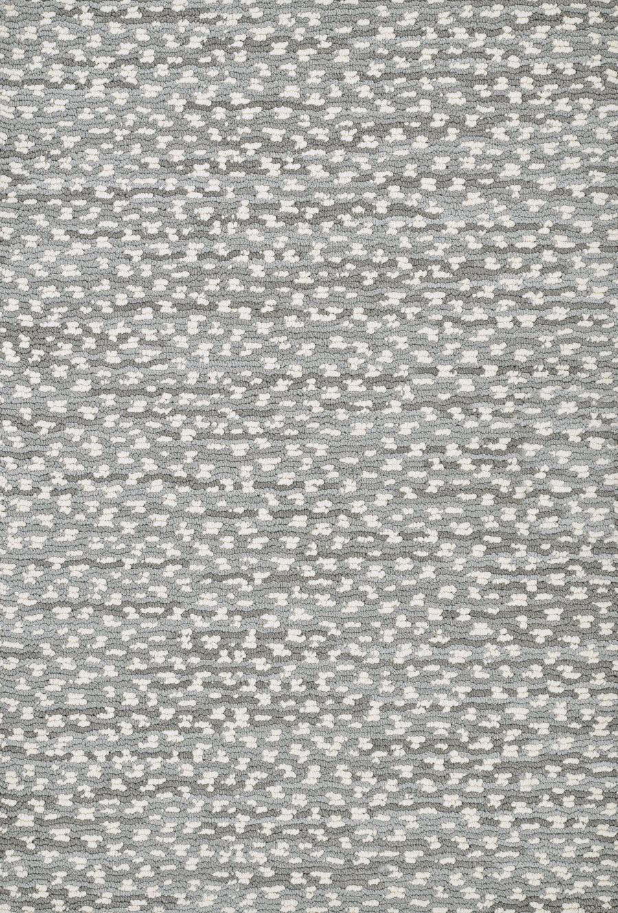 The Jag On Trend Carpet features a textured gray and white pattern with scattered, abstract dots—ideal for bringing a touch of luxurious elegance to any contemporary space.