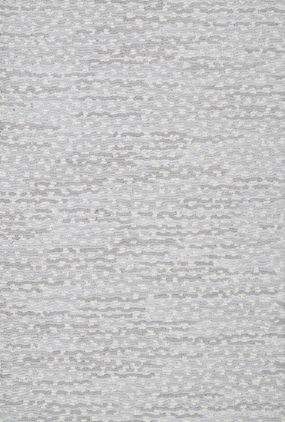 A close-up of the Jag On Trend Carpet in light gray shows its subtle, irregular dotted texture for a soft, understated look—ideal for those who want luxurious elegance in a stylish carpet.