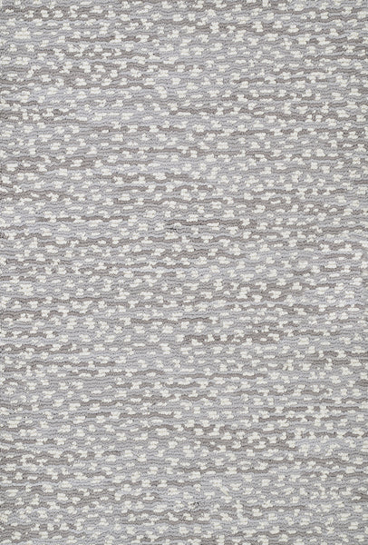 Close-up of Jag On Trend Carpet’s textured, woven fabric featuring small, irregular white and light gray shapes on a medium gray background, capturing its soft surface and luxurious elegance.