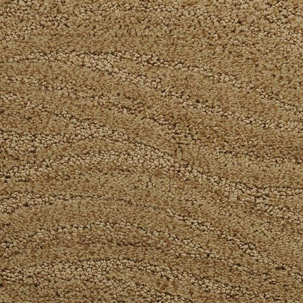 Close-up of Taittinger On Trend Carpet in Jamesboro Gold, featuring a textured wavy pattern and tightly woven fibers in beige and brown—perfect for high-traffic areas seeking durable flooring.