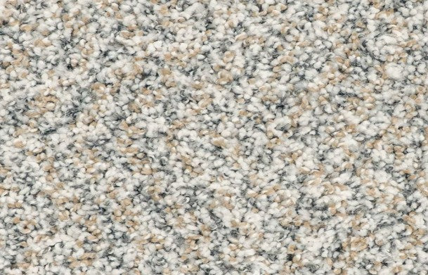 Close-up of the Innovative Comfort III Pet Friendly Carpet in Jubilee, showcasing its soft, speckled texture with beige, gray, and cream fibers. This luxury carpet is both stain resistant and pet friendly.