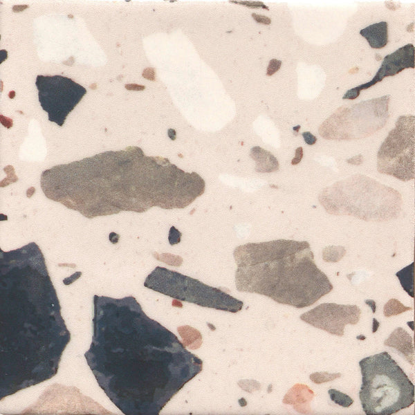 The Fragmento 5x5 Ceramic Tile in Just Peachy features a terrazzo-inspired look with a light beige base and scattered black, gray, and white stone-like fragments for a bold, speckled pattern and textured appearance.