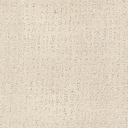 Close-up of Homage Berber Carpet in Kalista shows its textured beige surface with a subtle pattern of raised dots and lines. The soft, modern look makes it ideal for luxury, high-traffic areas.
