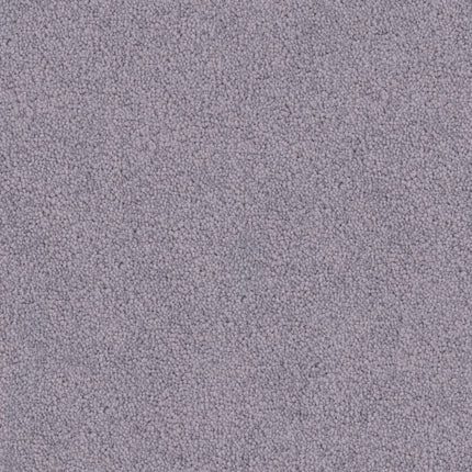 Close-up of Tribute Family Friendly Carpet in Karesse, featuring a light purple hue and dense looped pile. The tightly packed fibers create a soft, uniform, and durable surface ideal for family spaces.