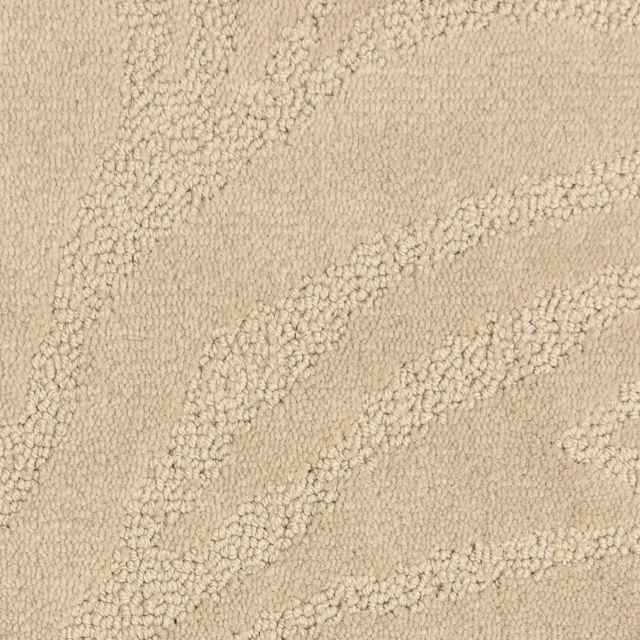 Close-up of the Capetown On Trend Carpet in Kruger—beige with raised, wavy abstract patterns. The looped and cut fibers offer subtle contrast, making it a stylish and durable choice for high-traffic areas.
