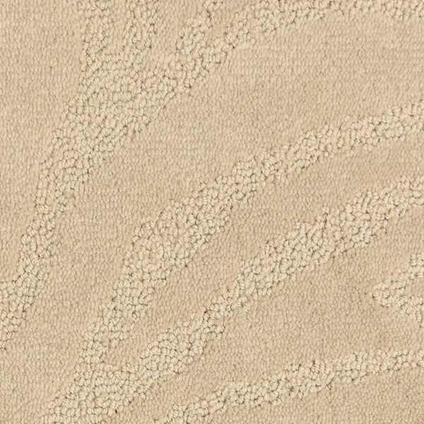 Close-up of the Capetown On Trend Carpet in Kruger—beige with raised, wavy abstract patterns. The looped and cut fibers offer subtle contrast, making it a stylish and durable choice for high-traffic areas.