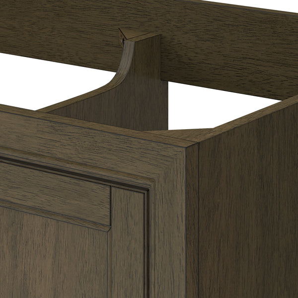 Close-up of a wooden cabinet with a decorative cutout at the back edge, showing the detailed wood grain and panel design in a dark brown finish. The top and part of the interior frame are visible.