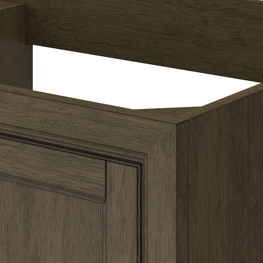 A close-up of a brown wooden cabinet with a rectangular cutout at the top, showing detailed wood grain and panel design on the front.