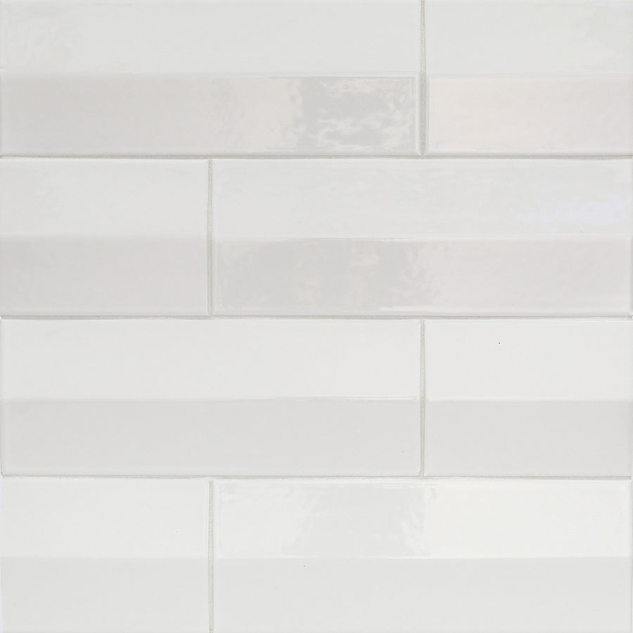 Shinju Mirai 3.5" x 9.5" Ceramic Tiles in Tent color, installed in a staggered brick pattern with a glossy finish, deliver a clean and modern wall surface.