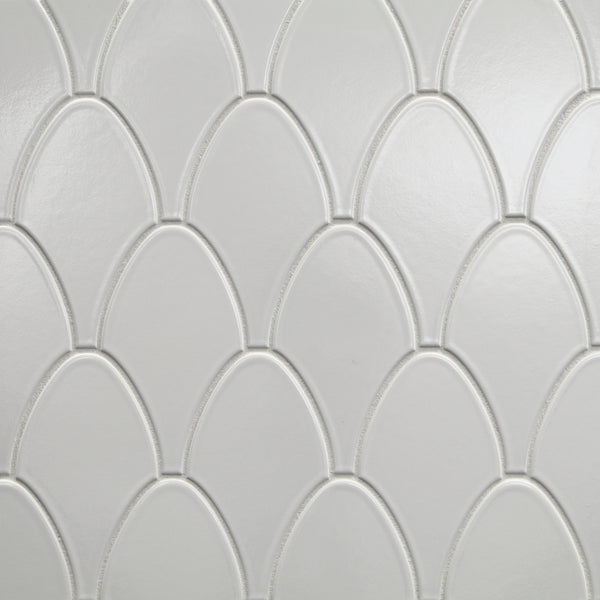The Shinju Stingray Mosaic Tile in Kumamoto features white ceramic tiles with a repeating stingray pattern, slightly raised borders, and a glossy finish for elegant light reflection.