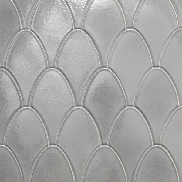 Close-up of Shinju Stingray Mosaic Tile in Moonstone, featuring a glossy gray surface with scalloped, fish scale–like pattern and subtle texture.