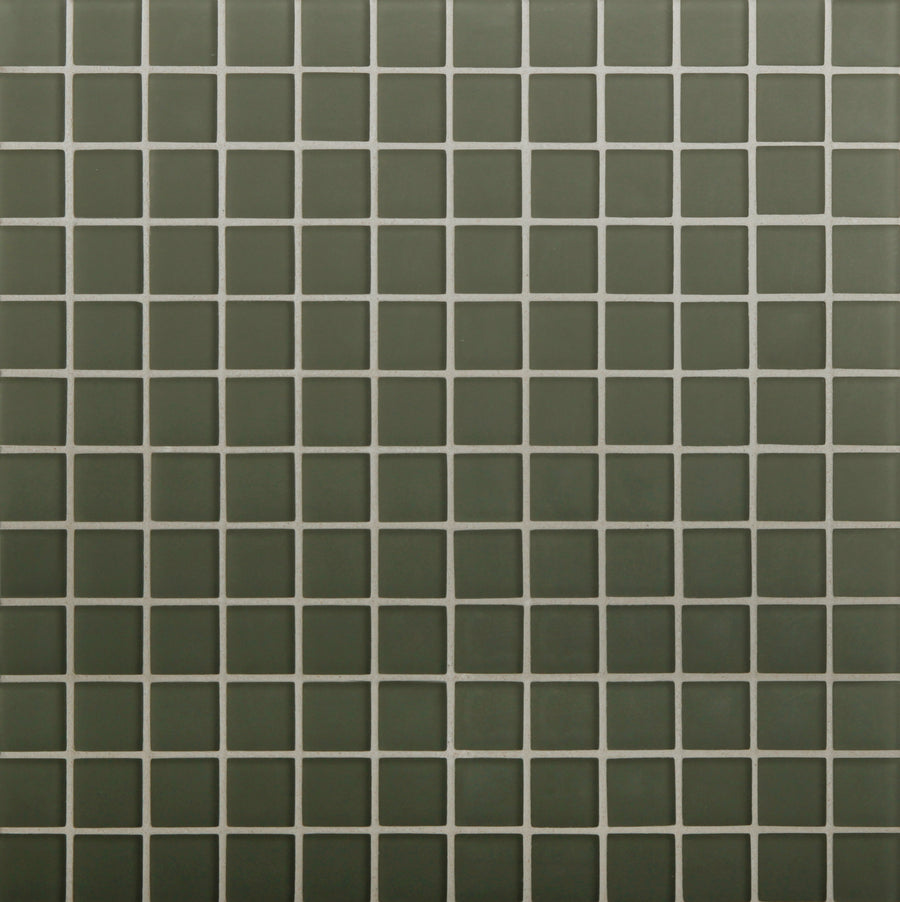 Tomei Mosaic Tile in Silk features a grid of dark green tiles with white grout lines, creating a uniform pattern ideal for contemporary design aesthetics.