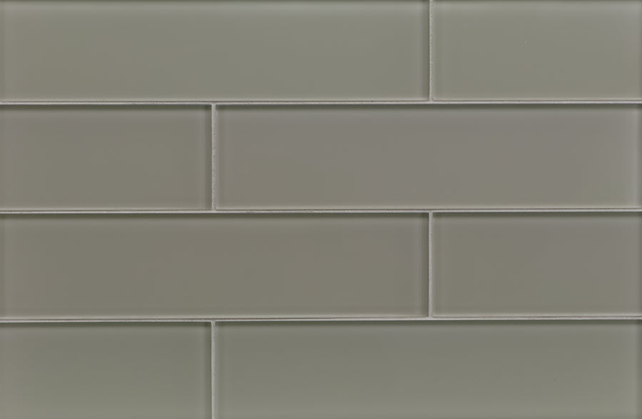 A close-up of a wall featuring Tomei 3" x 12" Subway Tile in Natural, arranged horizontally in a staggered brick pattern with visible grout lines—an elegant option for modern interiors or a sleek backsplash.