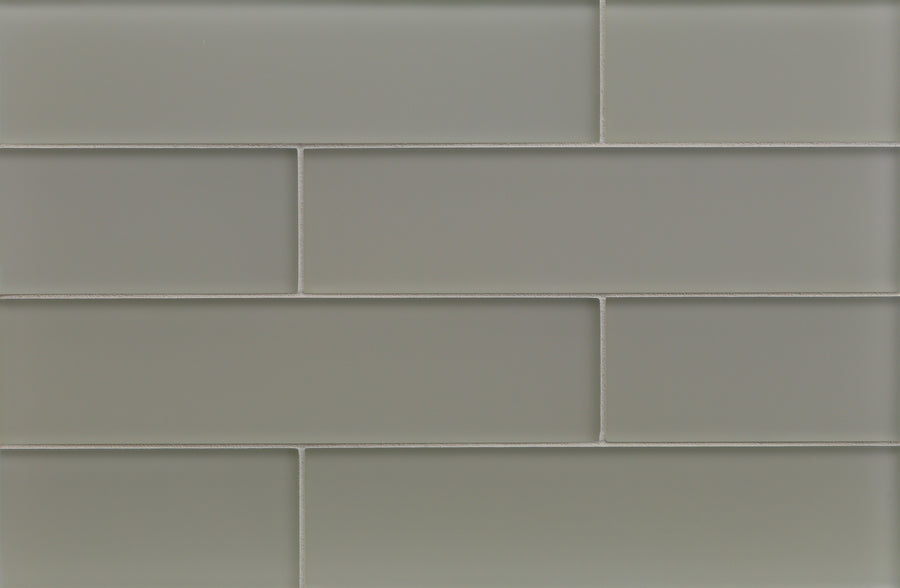 Tomei 3" x 12" Subway Tile in Silk, arranged in a staggered brick pattern with thin white grout, is perfect for a modern interiors backsplash.