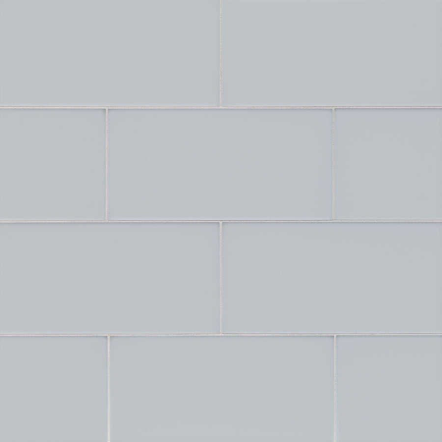 Tomei Modules 6" x 12" Subway Tile in Natural is arranged in a staggered brick pattern with thin grout lines, creating a clean and modern rectangular look.
