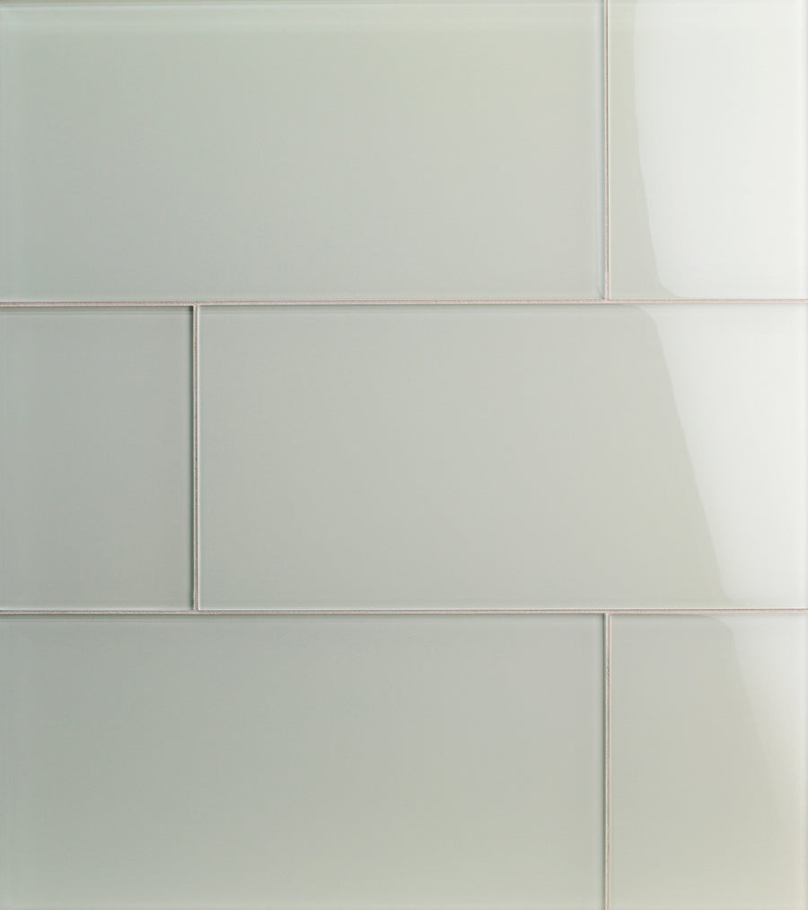 Close-up of Tomei Modules 9" x 18" Subway Tile in Natural, arranged in a staggered brick pattern with thin grout lines. The smooth, glossy surface adds contemporary elegance, perfect for modern interiors.