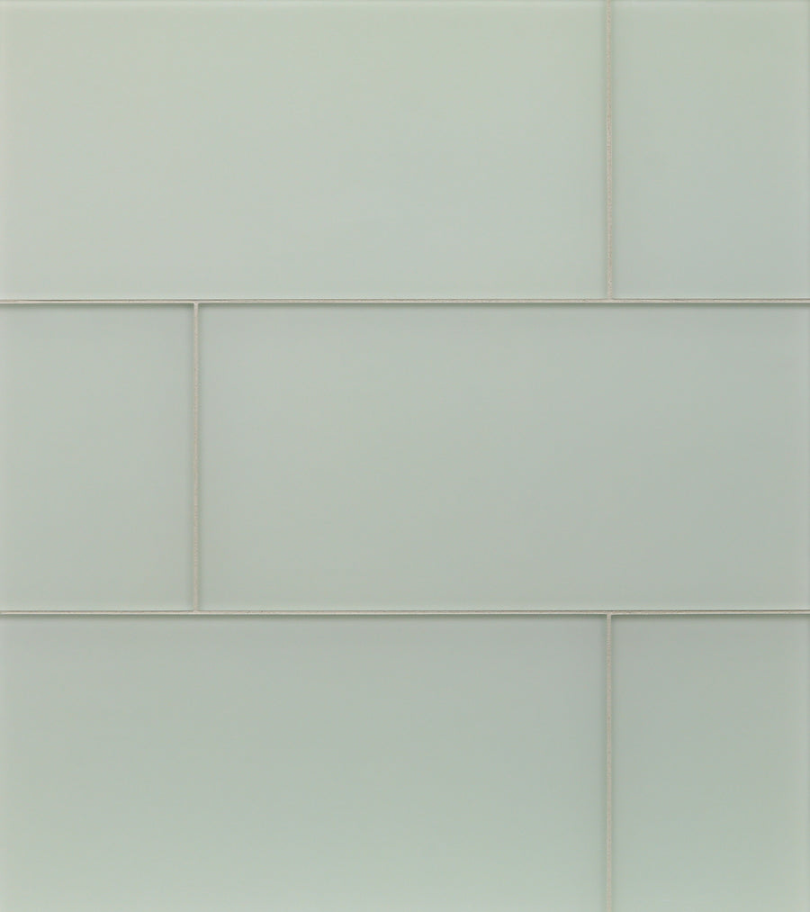 Close-up of a wall with Tomei Modules 9" x 18" Subway Tile in Silk, arranged in a staggered pattern with thin grout lines—an elegant and contemporary choice for modern interiors.