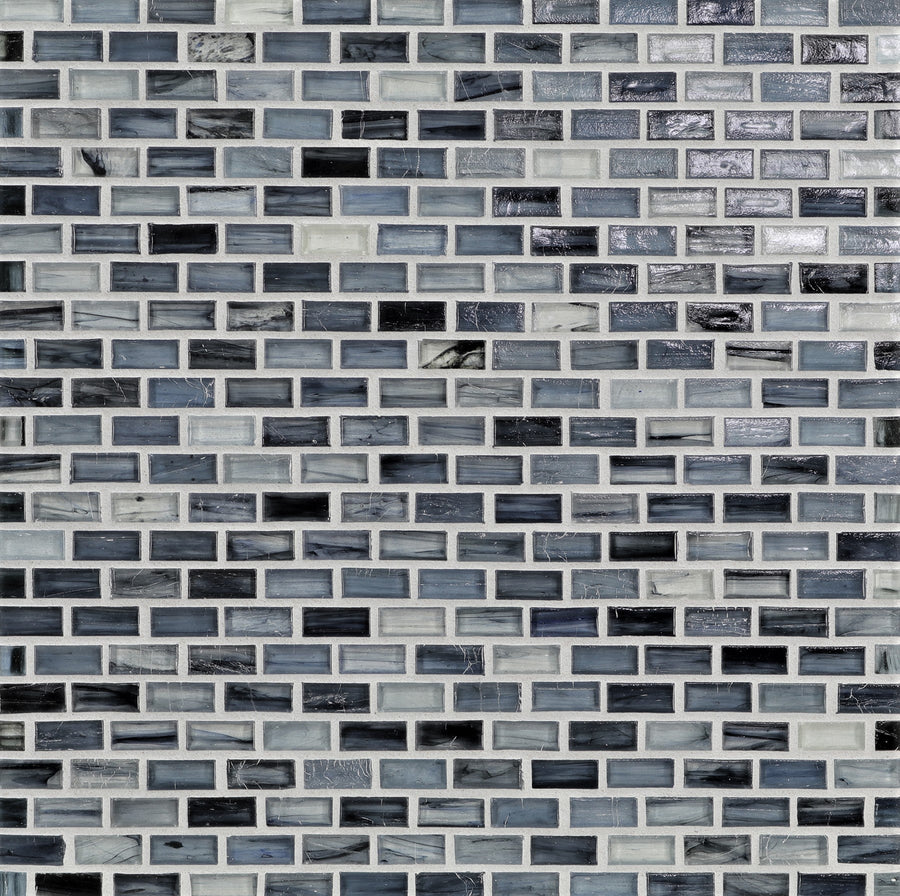 A close-up of Tozen Mini Mosaic Tile in Mini Brick Natural, showcasing small rectangular tiles in a staggered brick pattern—ideal for bringing a modern touch to any space.