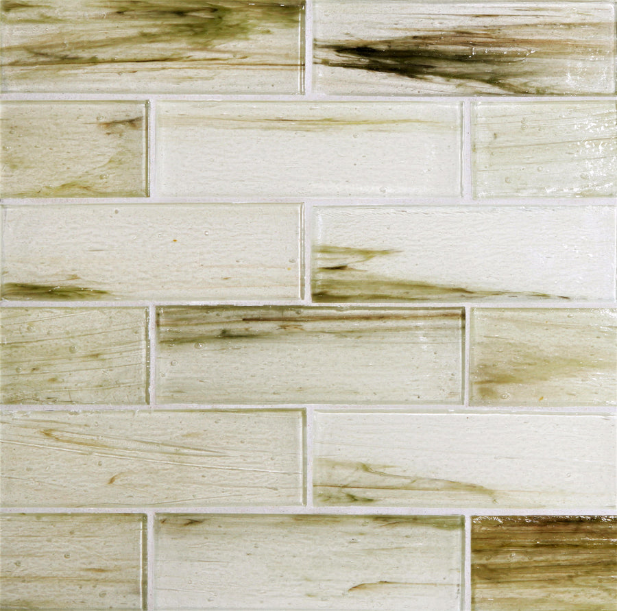 A close-up of a wall with Tozen 2" x 6" Selenium Subway Tile in Natural, arranged in a brick pattern and showcasing white and greenish-brown marbled streaks—ideal for adding luxurious style to kitchen backsplashes.