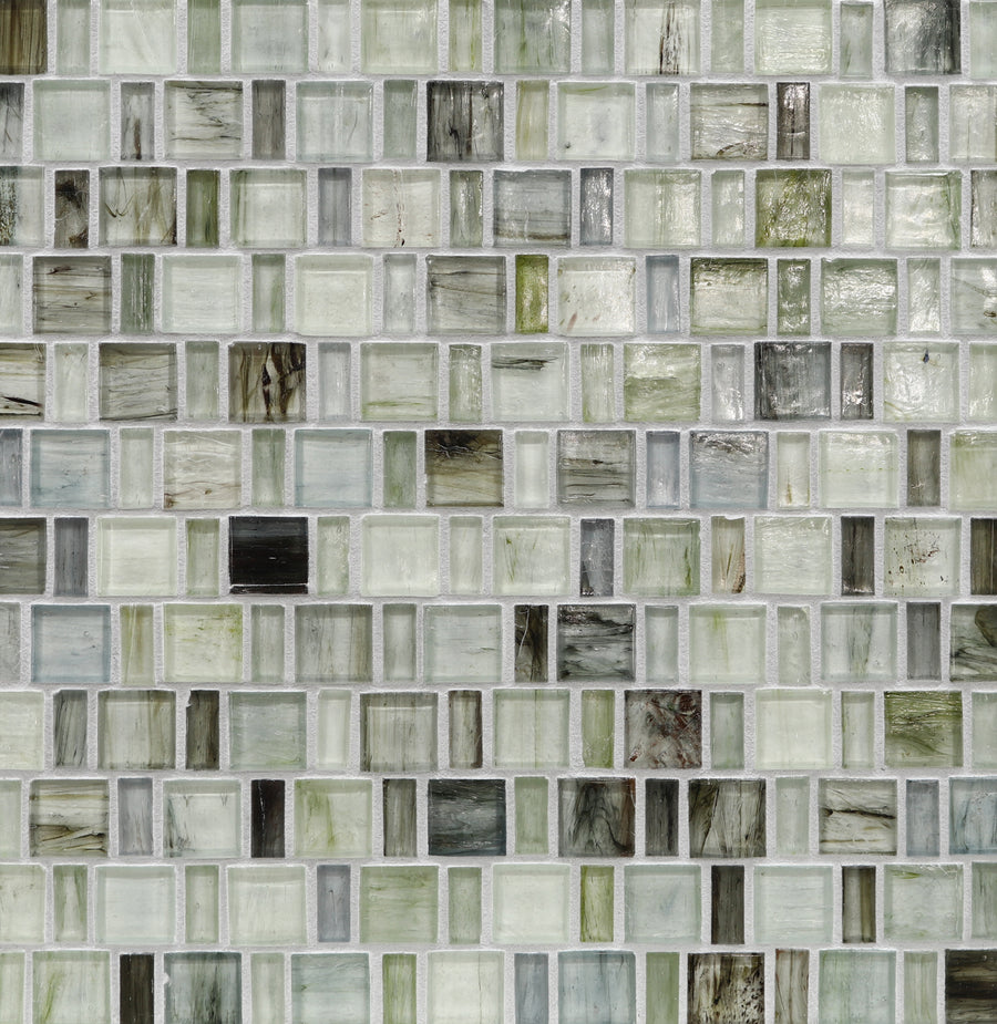 A close-up of the Tozen Japonaise Mosaic Tile in Natural, featuring small square glass tiles in white, gray, green, and beige tones that create a textured surface inspired by Japanese aesthetics.
