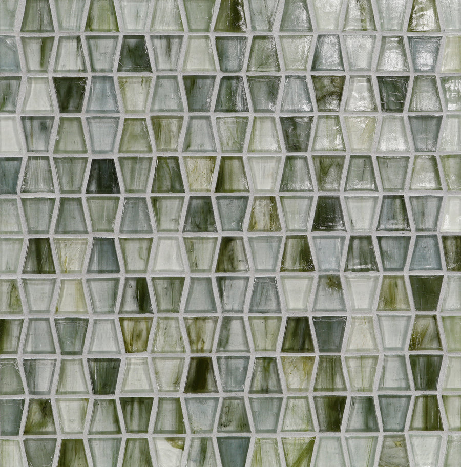 A close-up of a wall featuring Tozen Wings Mosaic Tile in the Wings Straight Set color, displaying glossy hexagonal and pentagonal tiles in green and white for a refined geometric mosaic pattern.