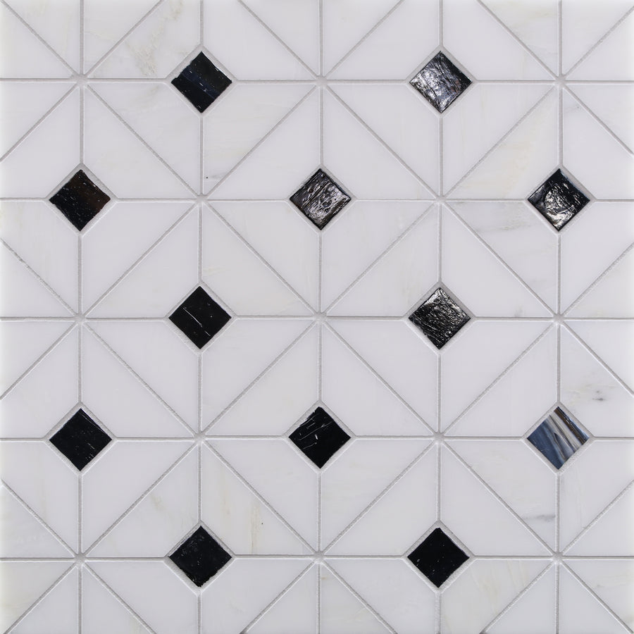 Geometric tile pattern features white triangles forming squares, each with Vesuvio Quilt Mosaic Tile in Night & Day as black diamond accents—ideal for backsplashes or accent walls on a crisp white background.