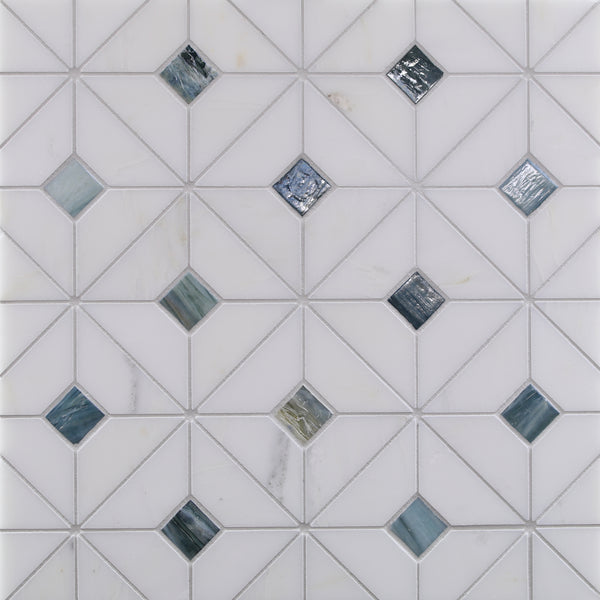 The Vesuvio Quilt Mosaic Tile in Palisades features a matte white, geometric triangle pattern with multicolored reflective glass accents, ideal for creating modern backsplashes or accent walls.