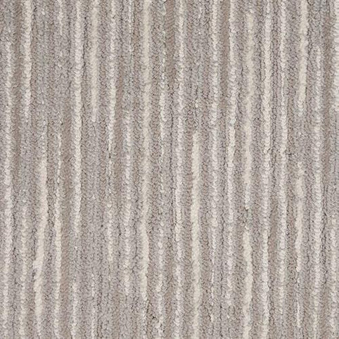 The Artist View On Trend Carpet in Landscape features a textured, striped pattern of light and dark gray vertical lines. Its soft, plush surface adds modern, durable comfort and a neutral style to any space.