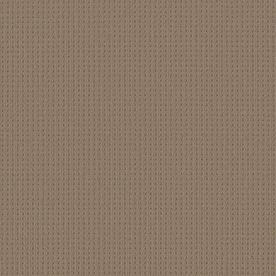 Close-up of San Lucas Family Friendly Carpet in Latte, featuring a textured, light brown knitted look with a vertical ribbed pattern. Evenly spaced stitches create a uniform, cozy appearance—ideal for high-traffic homes.