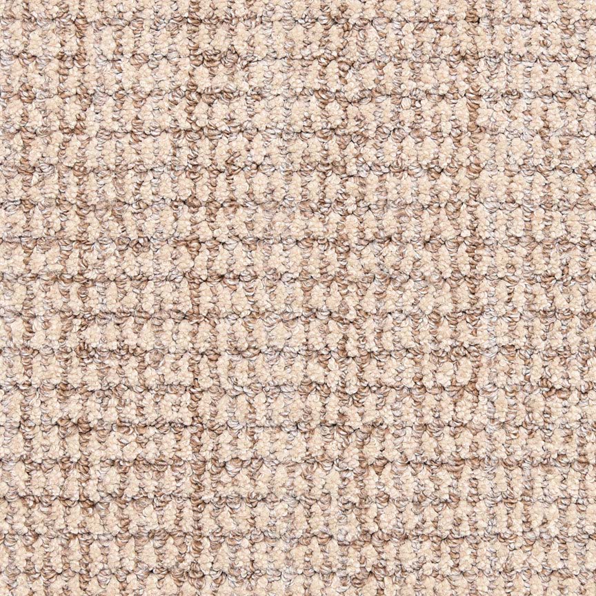 Close-up of the Aspen Berber Carpet in Latte shows its looped, grid-like pattern. The tightly woven fibers create a durable, uniform surface with subtle beige variations for understated elegance.