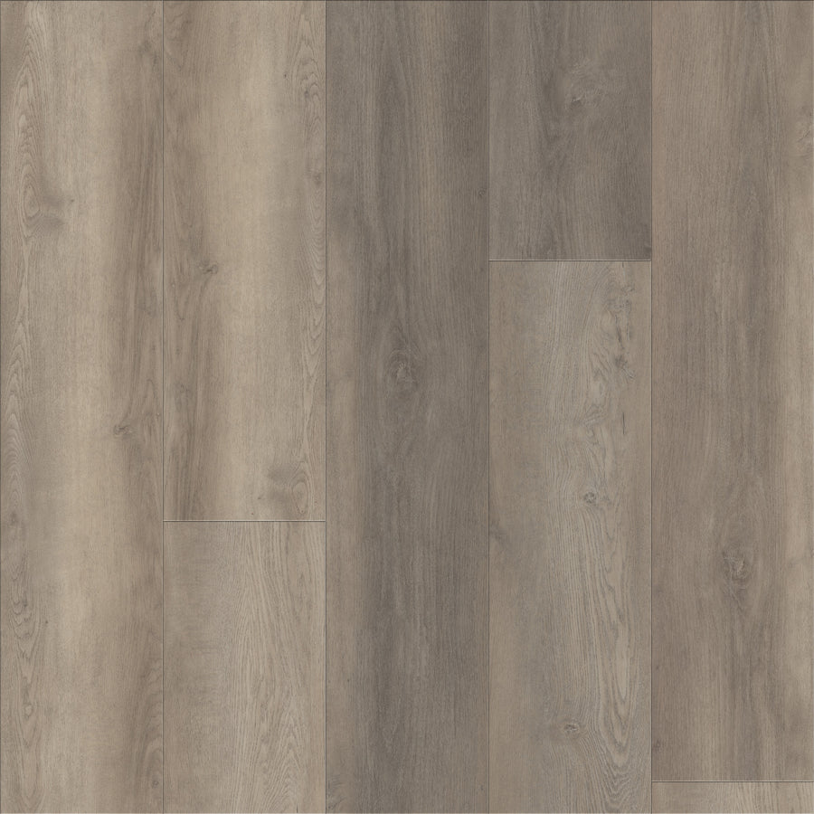 Coretec Plus Premium Vinyl features wide planks in grey and light brown tones with natural wood grain and subtle knots. This luxury vinyl flooring is durable, waterproof, and ideal for any space.