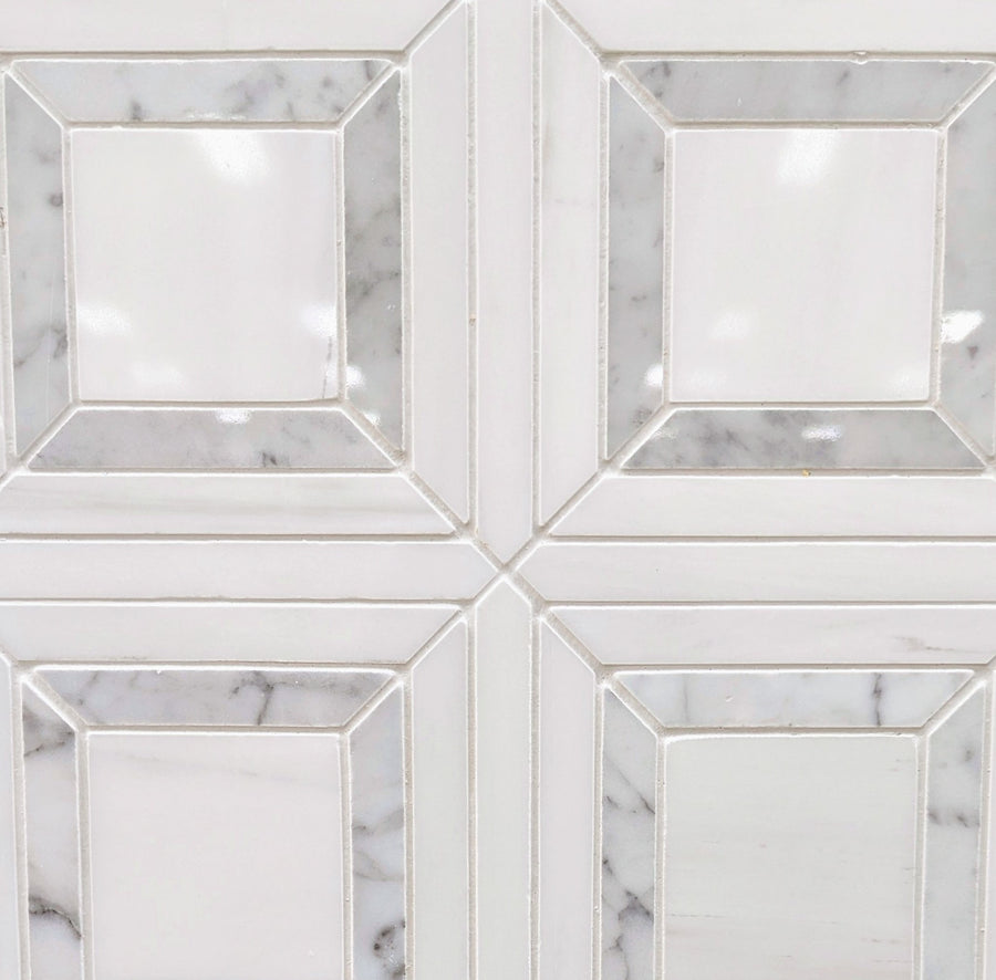 Lente Polished Marble Tile showcases a geometric square pattern with gray and white beveled edges. Its polished marble surface and soft veining bring modern elegance and a premium look to any space.