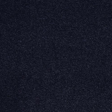 A close-up of the Grand Isle Family Friendly Carpet in Liberty color shows its dark, textured surface with a subtle, uniform pattern and deep gray tones.