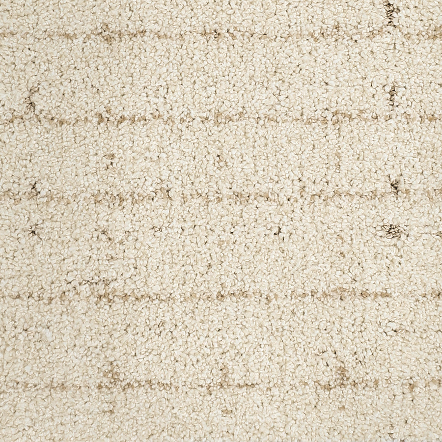 Close-up of the Furry Fun Pet Friendly Carpet, a luxury off-white option with subtle horizontal lines and a soft looped pile. Faint, irregular beige stripes add depth, making it a stylish and practical choice for any room.