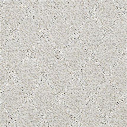 A close-up of Fine Art On Trend Carpet in Lucent shows its light beige color and subtle raised diamond pattern, offering a soft and elegant geometric look perfect for contemporary spaces.