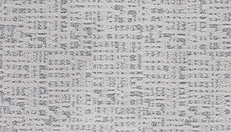 Close-up of Luxuriant Path Pet Friendly Carpet in Aurora color, featuring a light gray, stain-resistant surface with a subtle geometric pattern of raised and flat sections for a modern, abstract grid-like design.