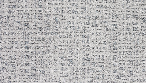 Close-up of Luxuriant Path Pet Friendly Carpet in Aurora color, featuring a light gray, stain-resistant surface with a subtle geometric pattern of raised and flat sections for a modern, abstract grid-like design.