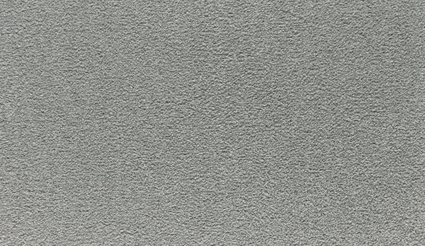 Close-up of Luxuriant Touch III Pet Friendly Carpet in Destiny, featuring a dense, even looped fiber texture. Its light gray surface is soft, stain resistant, and durable—ideal for an elegant, uniform look with no visible stains or markings.