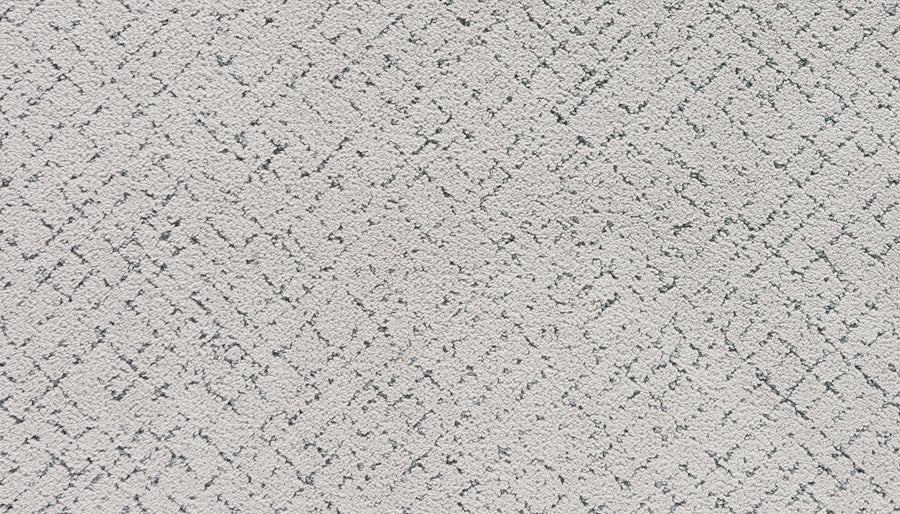 Close-up of Luxuriant Weave Pet Friendly Carpet in Aurora, featuring a subtle diamond and zigzag pattern with darker gray lines. The soft, slightly fuzzy texture is ideal for pets.