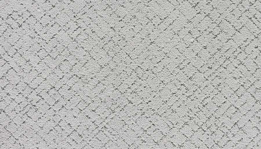 Luxuriant Weave Pet Friendly Carpet in Flute is a light gray, textured carpet featuring a subtle, irregular diamond and line pattern with slightly darker gray lines for lasting comfort and stylish appeal.