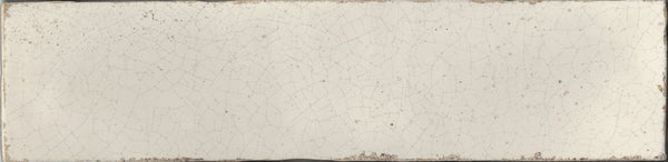 The Maiolica 3x12 Crackled Ceramic Subway Tile features an off-white, rectangular design with a visible crackle pattern and gently worn edges, capturing the timeless appeal of classic Maiolica craftsmanship.