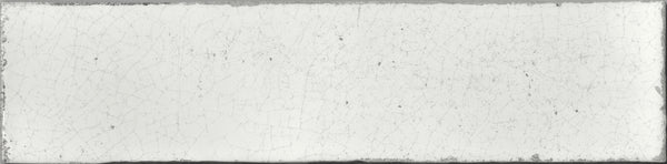 The Maiolica 3x12 Crackled Ceramic Subway Tile is a rectangular white tile with a slightly rough, crackled surface and subtle edge stains for an aged, weathered look.