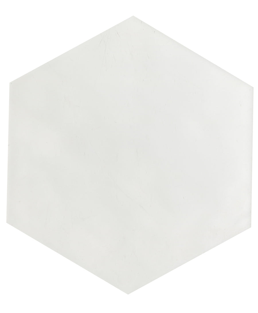 The Maiolica 7x8 Hexagon Ceramic Tile features a plain white hexagon shape on a white background, evoking the timeless look of a classic luxury ceramic tile design.