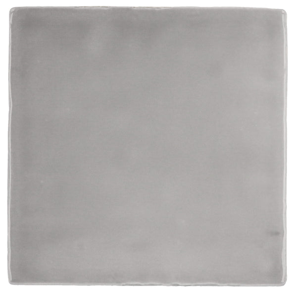 A plain, rectangular area rug in light Mercury Gray features a subtle, smooth texture and gently rounded edges, capturing the refined simplicity of Spanish style found in Manacor 4